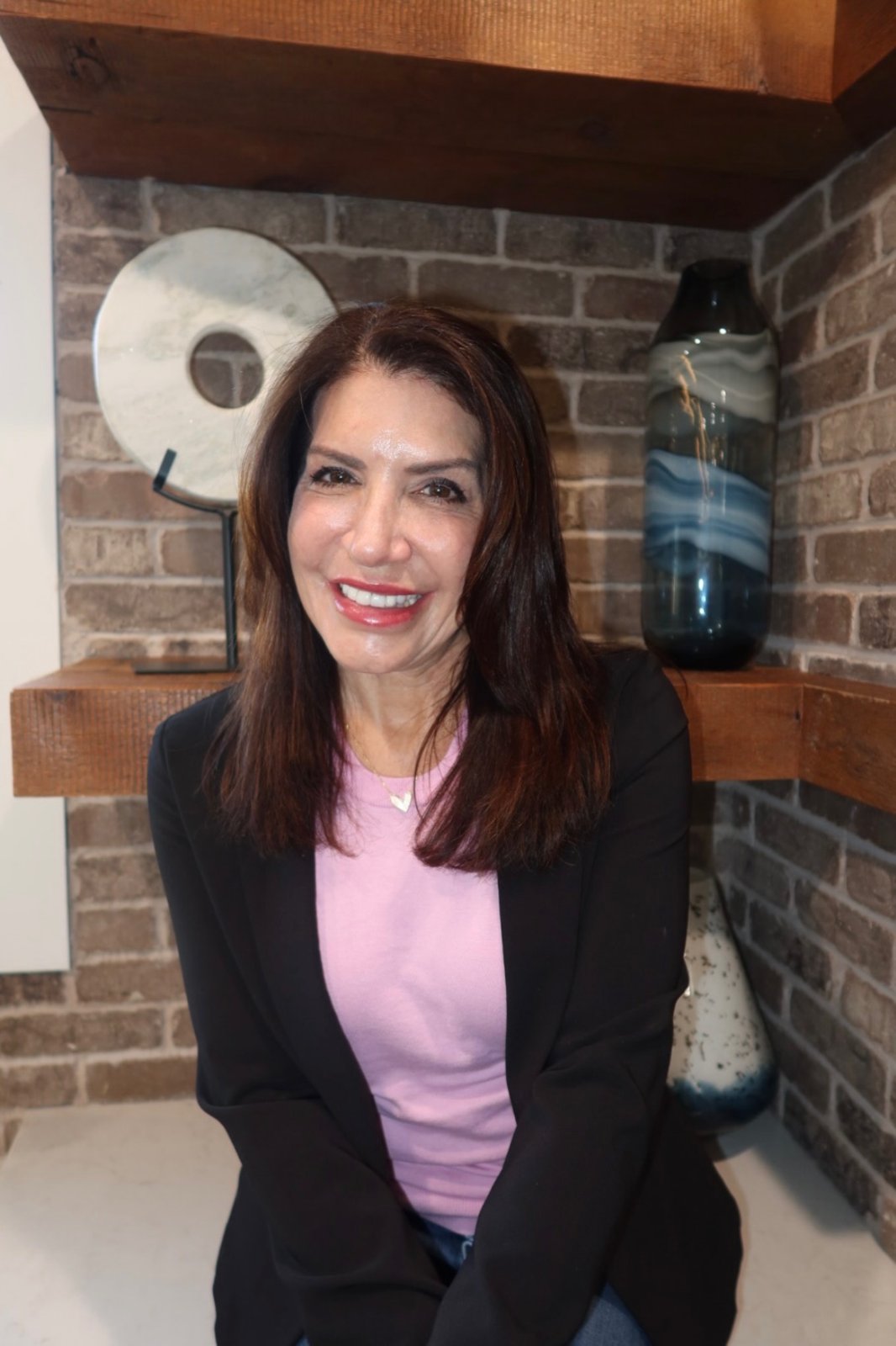 Meg Maginn seated in her office, smiling